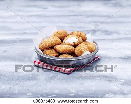 Bowl of fried chunky cod breaded nuggets on steel table View Large Photo Image Stock Image - Bowl of fried chunky cod breaded nuggets on steel table. Fotosearch