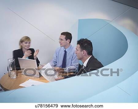 Stock Photo - Business colleagues in meeting. Fotosearch