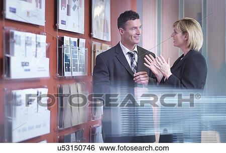 Stock Photograph -  Business colleagues in meeting. Fotosearch