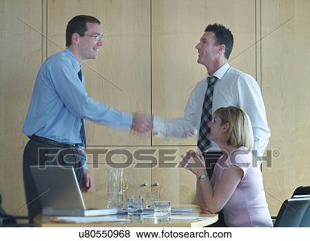 Businessmen shaking hands in meeting View Large Photo Image Stock Photo - Businessmen shaking hands in meeting. Fotosearch