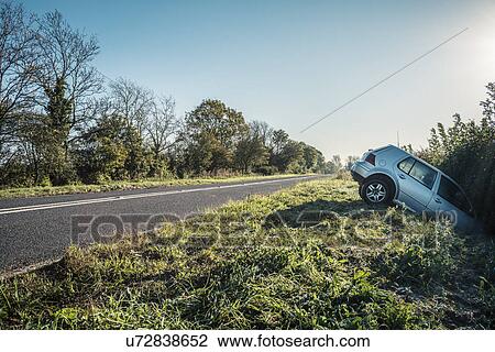 Car sticking out of hedge on rural highway roadside View Large Photo Image Stock Image - Car sticking out of hedge on rural highway roadside. Fotosearch