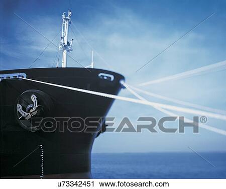 Cargo ship moored with ropes at port View Large Photo Image Stock Image - Cargo ship moored with ropes at port. Fotosearch