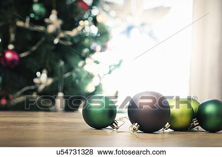 "Christmas baubles on floor, close up" View Large Photo Image Stock Photo - "Christmas baubles on floor, close up". Fotosearch