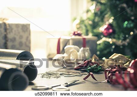 Stock Image - Christmas wrapping paper and ribbons. Fotosearch
