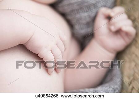 Stock Photograph - Close up of baby's hand. Fotosearch