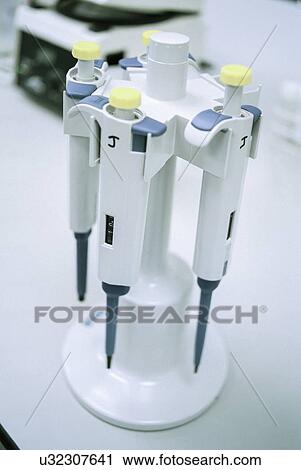 Stock Image - Close up of pipettes in laboratory. Fotosearch