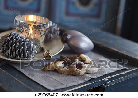 Stock Photo - "Cookies, pine cone, candle holder, ornament". Fotosearch