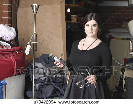 Picture - Corset maker in storage room. Fotosearch