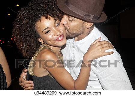 Stock Photo - "Couple hugging and kissing, close-up". Fotosearch