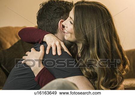 Couple hugging and smiling View Large Photo Image Stock Photo - Couple hugging and smiling. Fotosearch