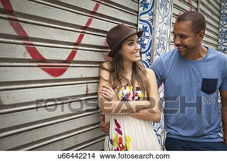 "Couple standing together, face to face, smiling" View Large Photo Image Picture - "Couple standing together, face to face, smiling". Fotosearch
