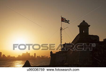 "Cuban flag over El Morro Fortress at sunset, Havana, Cuba" View Large Photo Image Stock Photo - "Cuban flag over El Morro Fortress at sunset, Havana, Cuba". Fotosearch