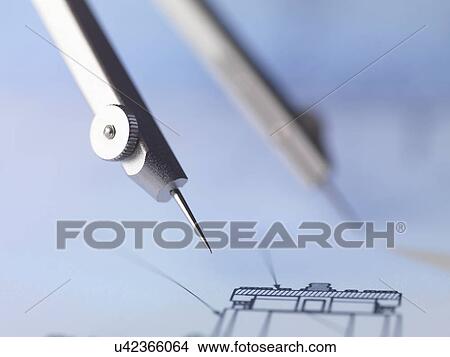 Picture - Dividers making a measurement on a engineering drawing. Fotosearch