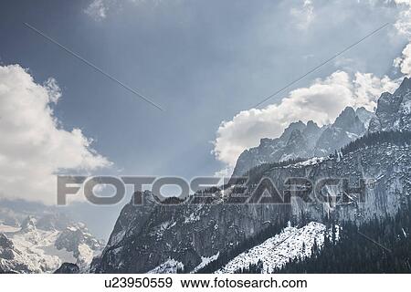 "Elevated view of snow covered mountains, Gosausee, Austria" View Large Photo Image Stock Photo - "Elevated view of snow covered mountains, Gosausee, Austria". Fotosearch