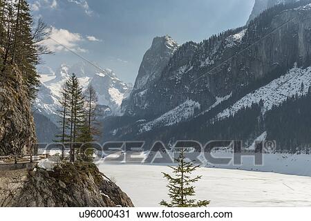 "Elevated view of snow covered valley and mountains, Gosausee, Austria" View Large Photo Image Stock Image - "Elevated view of snow covered valley and mountains, Gosausee, Austria". Fotosearch