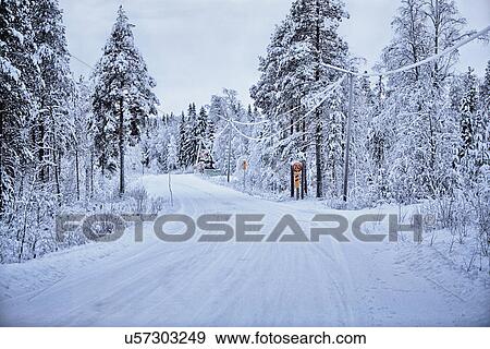 Stock Photo - "Empty snow covered rural road, Hemavan, Sweden". Fotosearch
