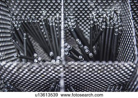 Stock Photo - Engineered parts ready for cleaning. Fotosearch