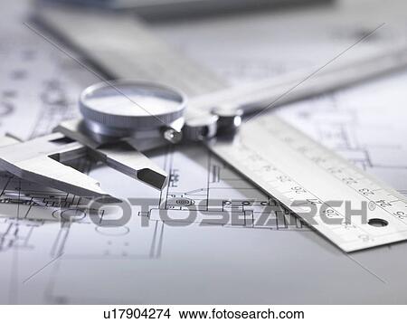 Picture - Engineering measurement and drawing equipment on design drawing. Fotosearch