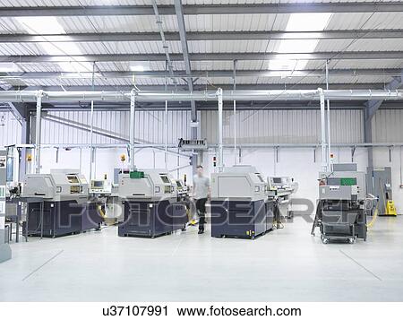 Stock Image - Engineering production line in factory. Fotosearch