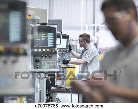 Engineers operating CNC lathes in factory View Large Photo Image Stock Photography - Engineers operating CNC lathes in factory. Fotosearch