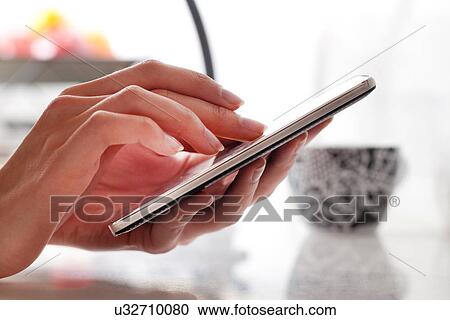 Female hands using smartphone View Large Photo Image Stock Image - Female hands using smartphone. Fotosearch