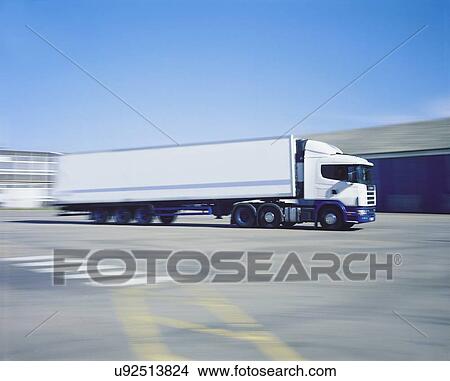 Picture - Freezer truck on the move in port. Fotosearch