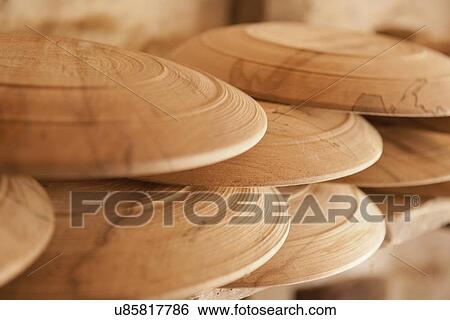 Stock Photograph - "Hand turned wooden plates, close-up". Fotosearch