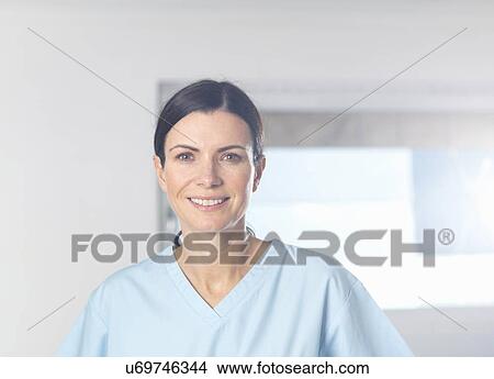 "Health worker at work, window in background. " View Large Photo Image Picture - "Health worker at work, window in background. ". Fotosearch