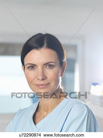 "Health worker at work, window in background. " View Large Photo Image Picture - "Health worker at work, window in background. ". Fotosearch