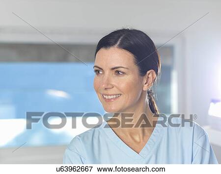 "Health worker at work, window in background. " View Large Photo Image Stock Photo - "Health worker at work, window in background. ". Fotosearch