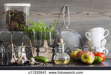 "Kitchen work surface with crockery, kitchen utensils and ingredients, still life" View Large Photo Image Stock Image - "Kitchen work surface with crockery, kitchen utensils and ingredients, still life". Fotosearch