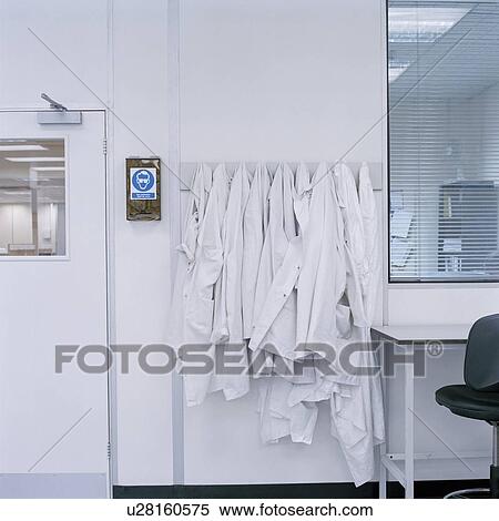 Stock Photography - Lab coats on hooks in laboratory. Fotosearch