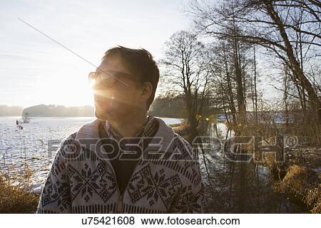 Stock Photo - "Man enjoying nature in winter, Teising, Bayern, Deutschland". Fotosearch