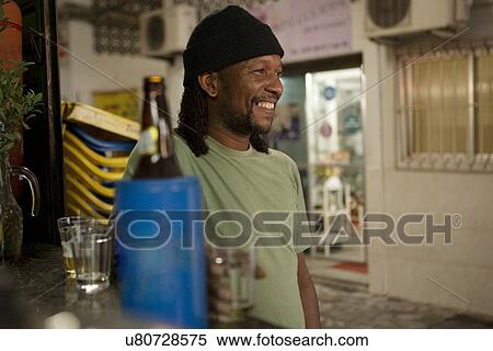 Man relaxing with beer in pub View Large Photo Image Stock Photography - Man relaxing with beer in pub. Fotosearch