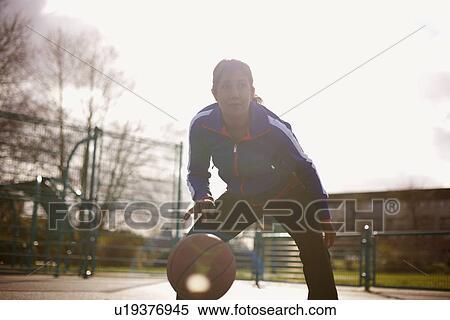 Mature woman playing basketball in park View Large Photo Image Stock Photography - Mature woman playing basketball in park. Fotosearch