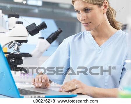 Medical scientist viewing patients test results on a computer View Large Photo Image Stock Photo - Medical scientist viewing patients test results on a computer. Fotosearch