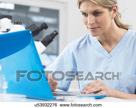 Medical scientist viewing patients test results on a computer View Large Photo Image Stock Photograph - Medical scientist viewing patients test results on a computer. Fotosearch