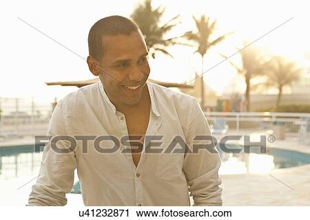 "Mid adult man at hotel swimming pool, Rio De Janeiro, Brazil" View Large Photo Image Stock Image - "Mid adult man at hotel swimming pool, Rio De Janeiro, Brazil". Fotosearch