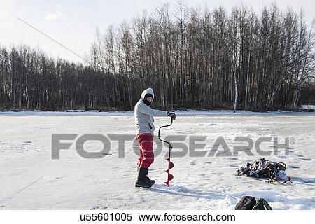 "Mid adult man ice drilling, Fairbanks, Alaska" View Large Photo Image Stock Photography - "Mid adult man ice drilling, Fairbanks, Alaska". Fotosearch