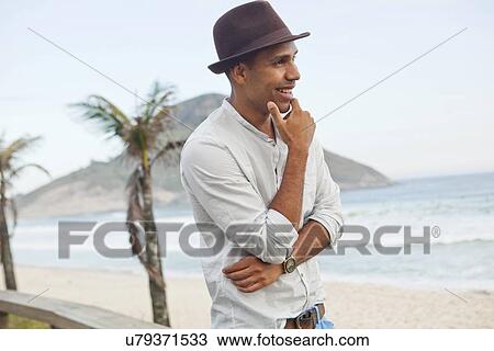 "Mid adult man looking out to sea, Rio De Janeiro, Brazil" View Large Photo Image Stock Image - "Mid adult man looking out to sea, Rio De Janeiro, Brazil". Fotosearch