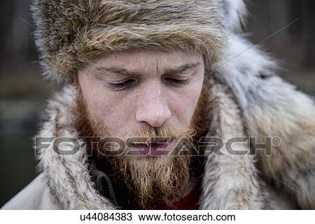 "Mid adult man wearing trapper hat, portrait" View Large Photo Image Stock Image - "Mid adult man wearing trapper hat, portrait". Fotosearch