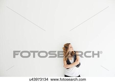 Mid adult woman arms crossed looking away View Large Photo Image Picture - Mid adult woman arms crossed looking away. Fotosearch