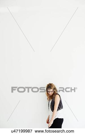"Mid adult woman looking down, copy space" View Large Photo Image Stock Photo - "Mid adult woman looking down, copy space". Fotosearch
