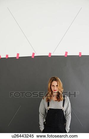 Mid adult woman standing with hands in pockets View Large Photo Image Stock Photography - Mid adult woman standing with hands in pockets. Fotosearch