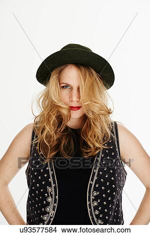 "Mid adult woman wearing hat, looking at camera" View Large Photo Image Picture - "Mid adult woman wearing hat, looking at camera". Fotosearch