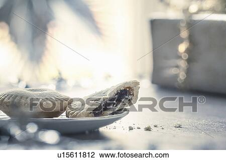 Mince pies with missing bite on plate View Large Photo Image Stock Image - Mince pies with missing bite on plate. Fotosearch