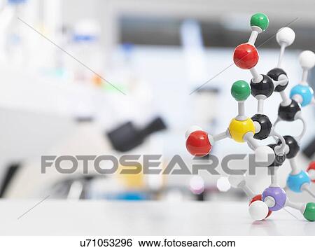 Stock Photograph - Molecular model structure sitting on a lab bench during a experiment.. Fotosearch