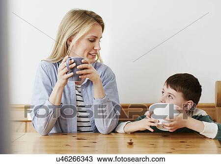 Mother and son having breakfast View Large Photo Image Stock Image - Mother and son having breakfast. Fotosearch