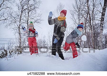 "Mother and two sons throwing snowballs, Hemavan, Sweden" View Large Photo Image Stock Photo - "Mother and two sons throwing snowballs, Hemavan, Sweden". Fotosearch