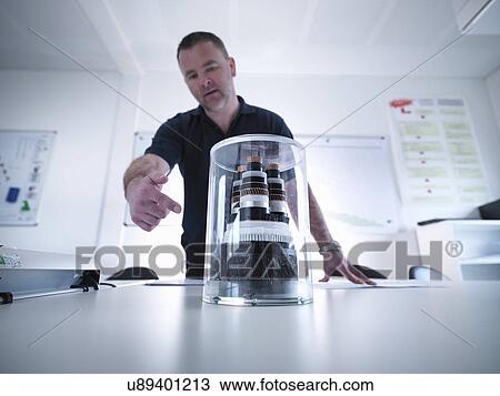 Offshore windfarm engineer discussing power cable sample in conference room View Large Photo Image Stock Image - Offshore windfarm engineer discussing power cable sample in conference room. Fotosearch